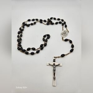 Silver tone and black beaded rosary.